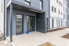 Erstbezug in hochwertiger Wohnung mit Balkon und Bergblick - Neue Einbauküche inklusive - Hauseingang