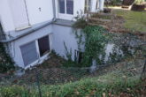 Gut vermietete Gartenwohnung mit Tiefgarage in ruhiger Haarer Wohnlage zu verkaufen EG + Souterrain - Lichtgraben