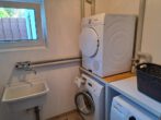Neuwertige Erdgeschoßwohnung mit kleinem Garten und Garage, demnächst frei werdend in schöner Lage. - Waschmaschinenraum